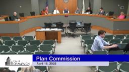 City Council Chambers showing Dias with Plan Commissioners. A couple of people are shown in the audience.