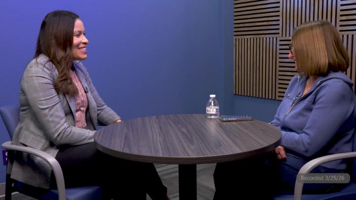 Council Member Clayborn and Mayor Feinen sitting at table in studio. 